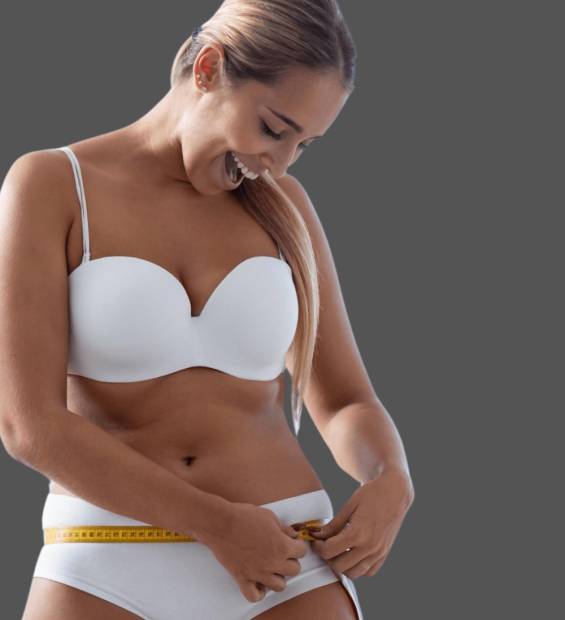 woman in white bra and underwear measuring her waist